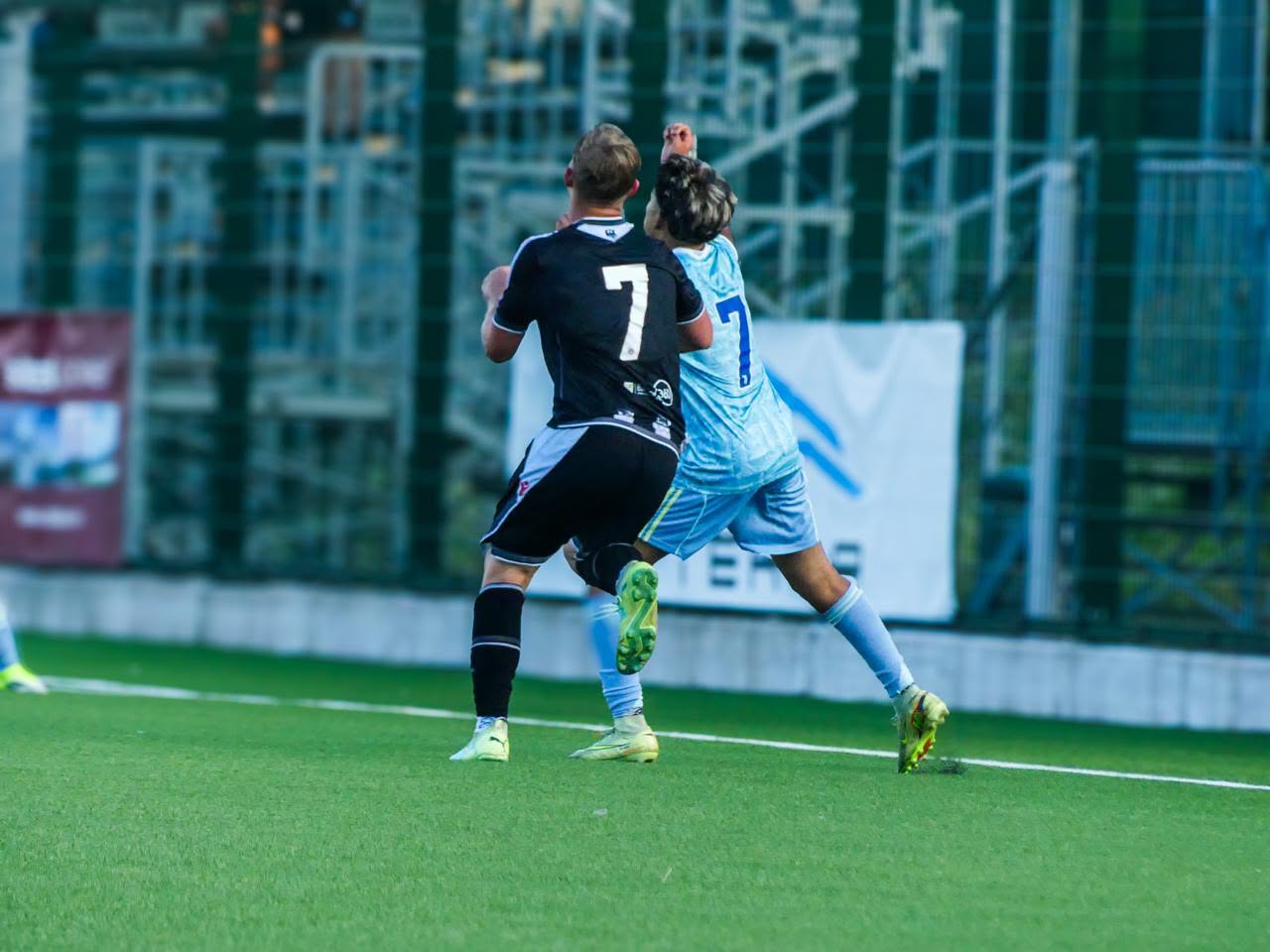 Eric battling for the ball wearing #7