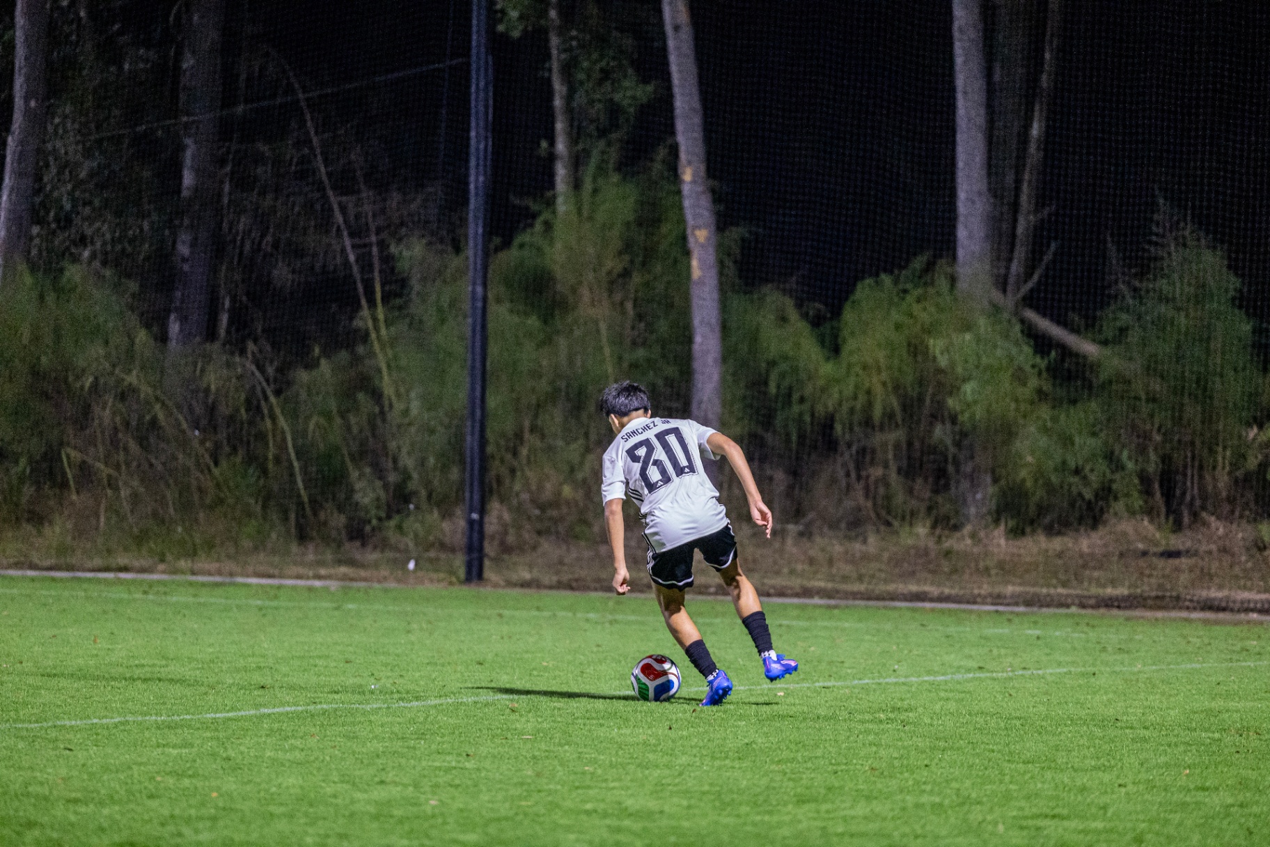 Eric on the ball wearing #20