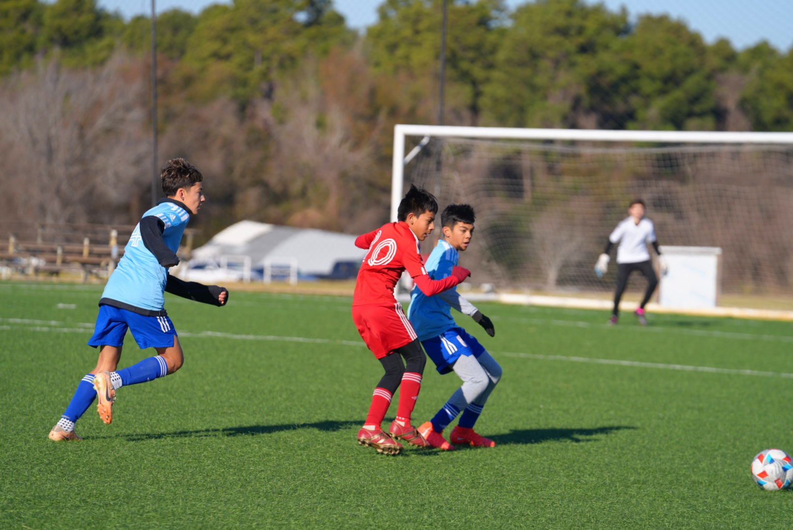 Eric battling for the ball in MAFC blue