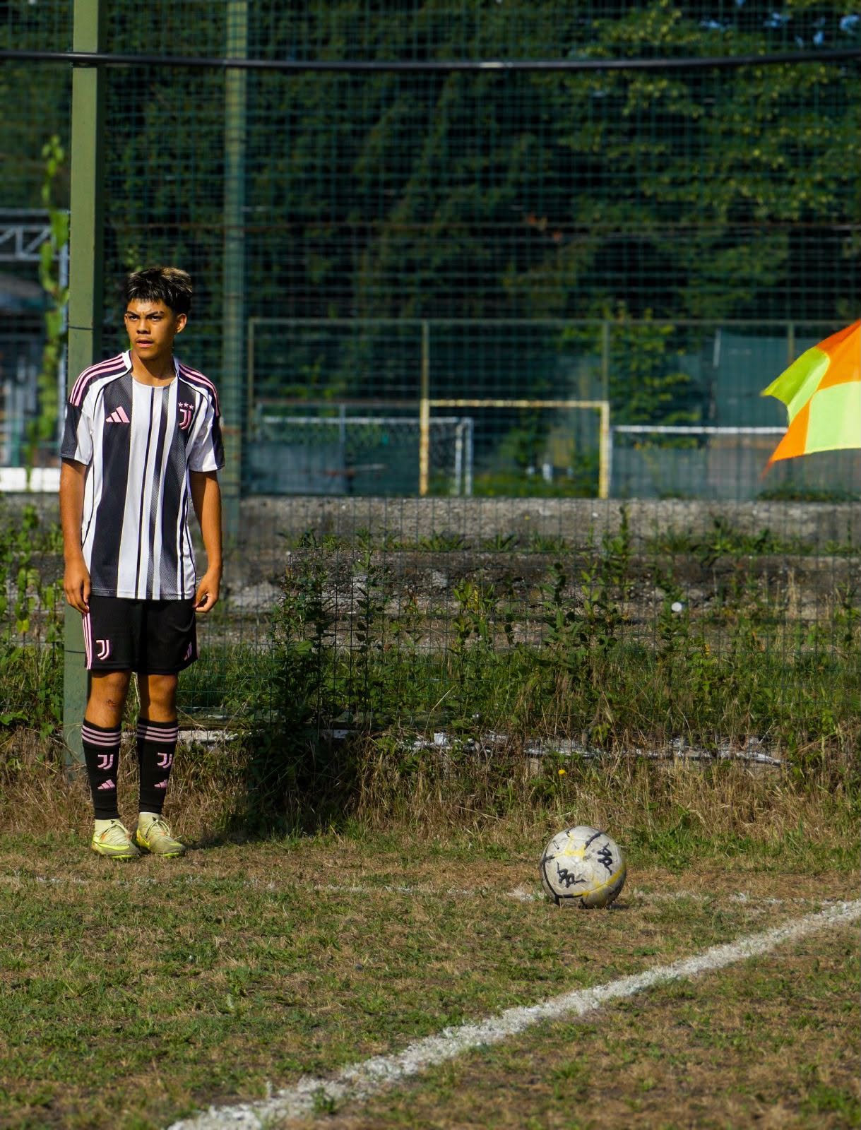 Eric standing by the corner flag