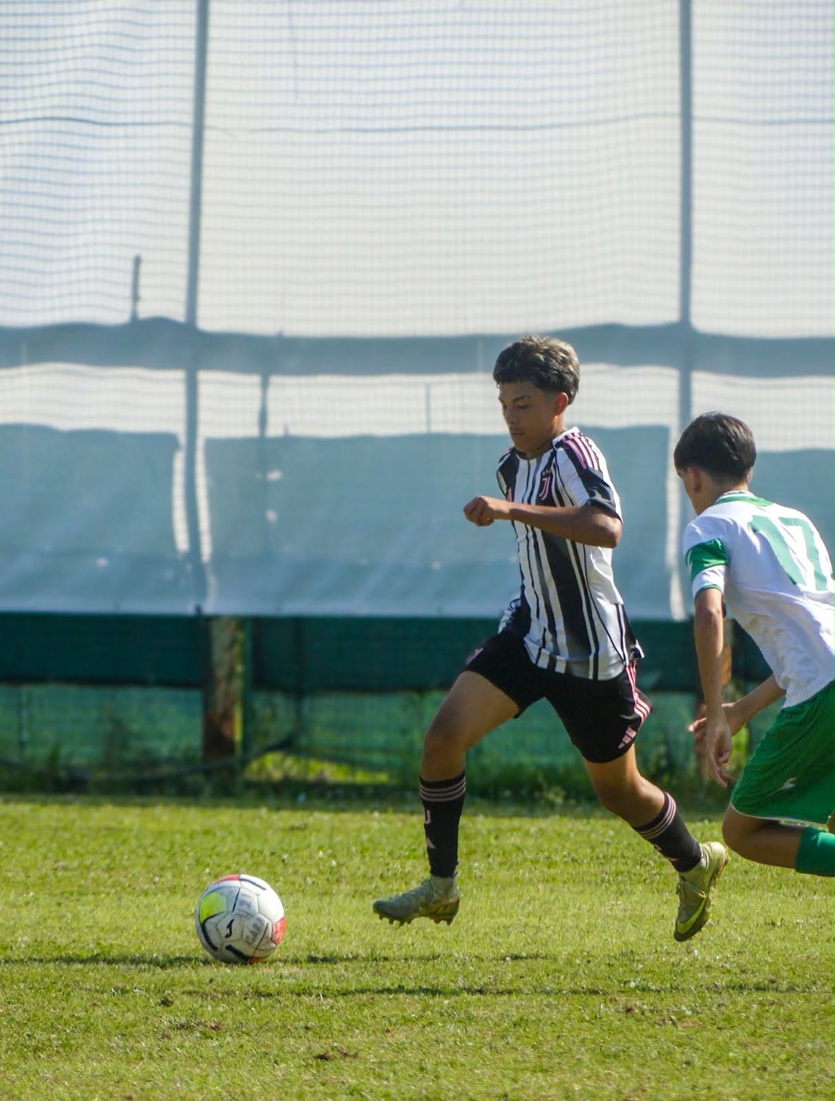 Eric sprinting past a defender in Juventus kit