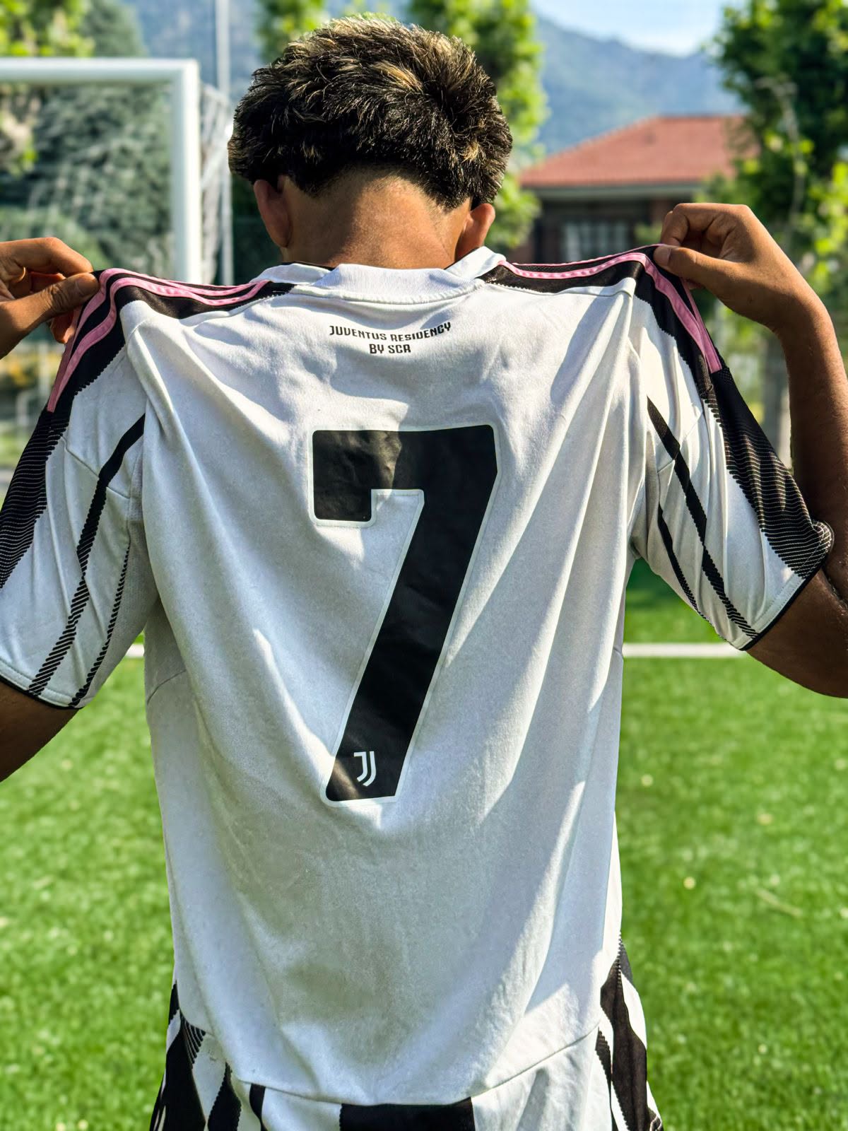 Eric showing the Juventus Residency #7 shirt